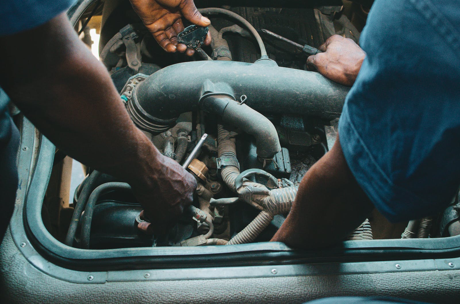 Mechanics working on an Engine